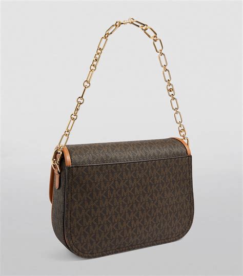 michael kors saddle|michael kors triple compartment bag.